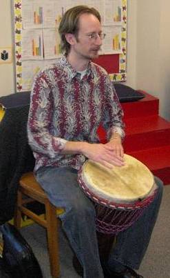 Andrew leads a school drum workshop